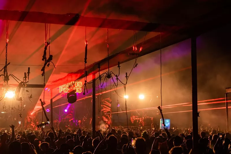 Image: Laser lights shining over the crowd at Factory Town