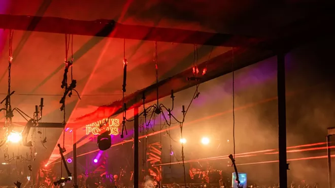 Laser lights shining over the crowd at Factory Town