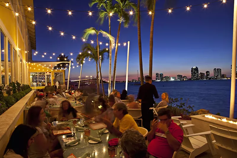 Image: nighttime terrace with people