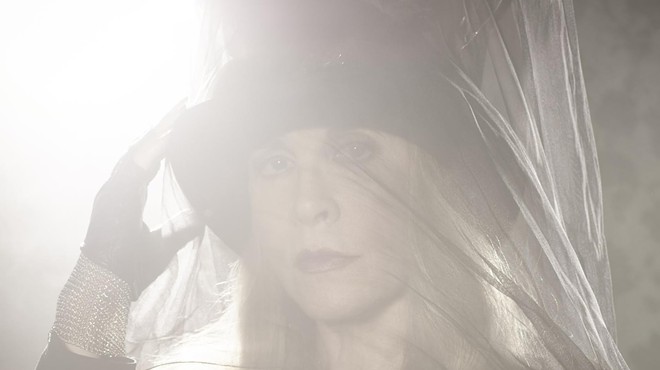 Stevie Nicks wearing a hat and veil