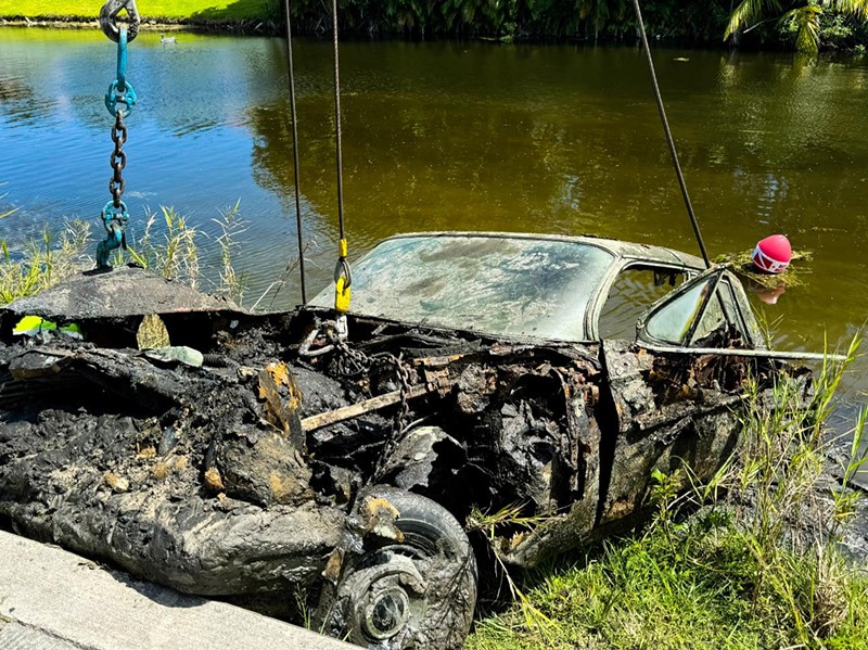 A rusted vehicle is recovered from a Plantation canal after Sunshine State Sonar discovered the wreckage believed to contain the remains of Caren and Doris Wurst.