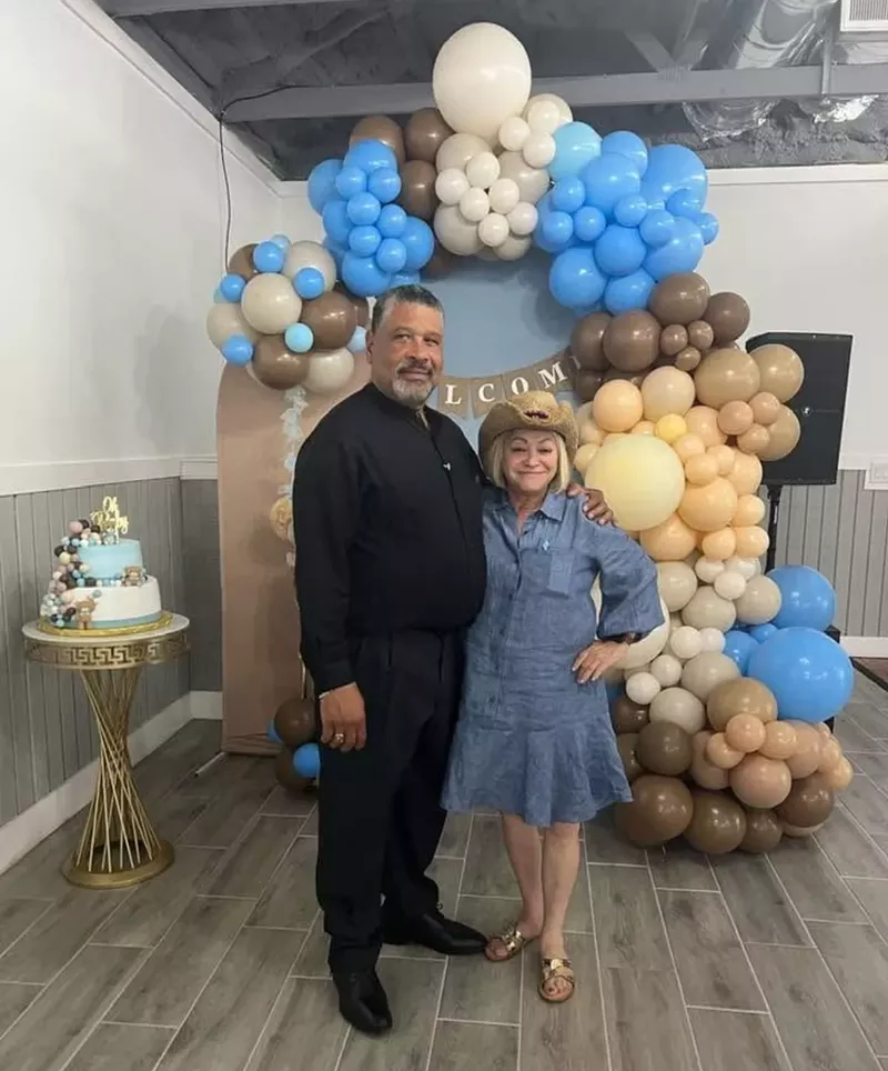 Image: Sonia Bichara (right) and Rafael Collodo pose for a picture in front of balloons