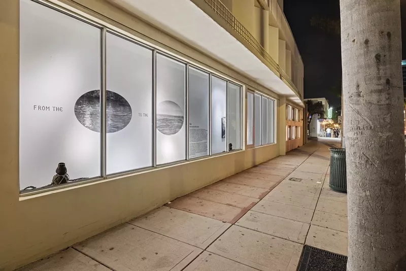 Image: Vũ Hoàng Khánh Nguyên's How we live like water in the window display of a Miami Beach Walgreens