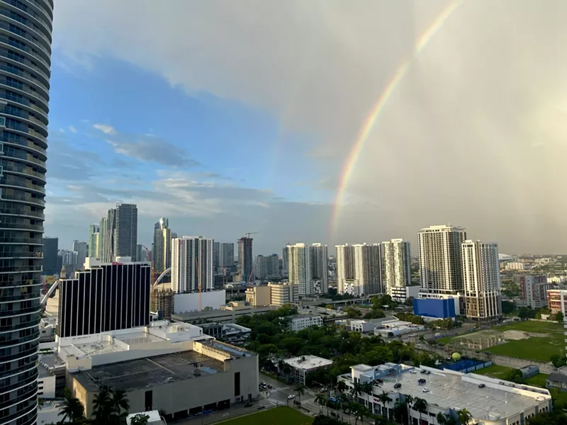 Image: A brilliant rainbow arches over the skyline, brightening Miami after days of storms.