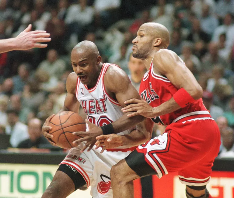 Image: Tim Hardaway appears oddly surprised by a basketball during an April 1996 game against the Chicago Bulls.