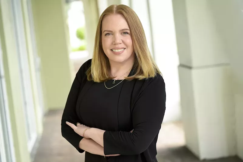 Image: Amy Galpin with her arms crossed stares at the camera