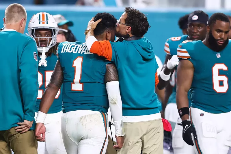 Miami Dolphins head coach Mike McDaniel embraces the team's quarterback, Tua Tagovailoa, as he exits the September 12, 2024, game against the Buffalo Bills after a third-quarter concussion.