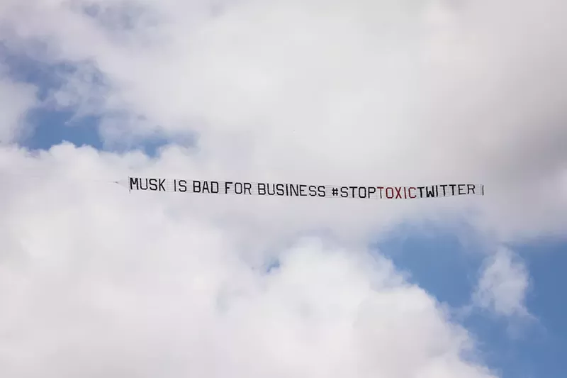Image: Activists flew banners above the Fontainebleau on April 18 to protest Twitter's tolerance of hate speech.