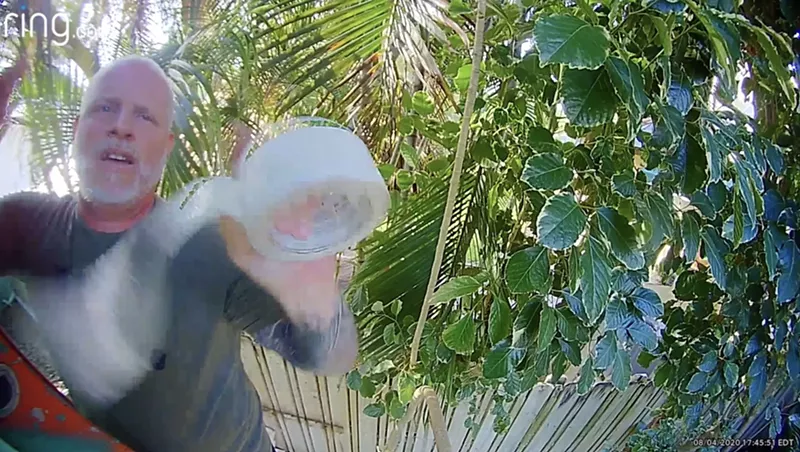 Image: A security camera mounted on the side of Whitney Fair's house captured this footage of Broward sheriff's Lt. Jeff Mellies in August 2020.