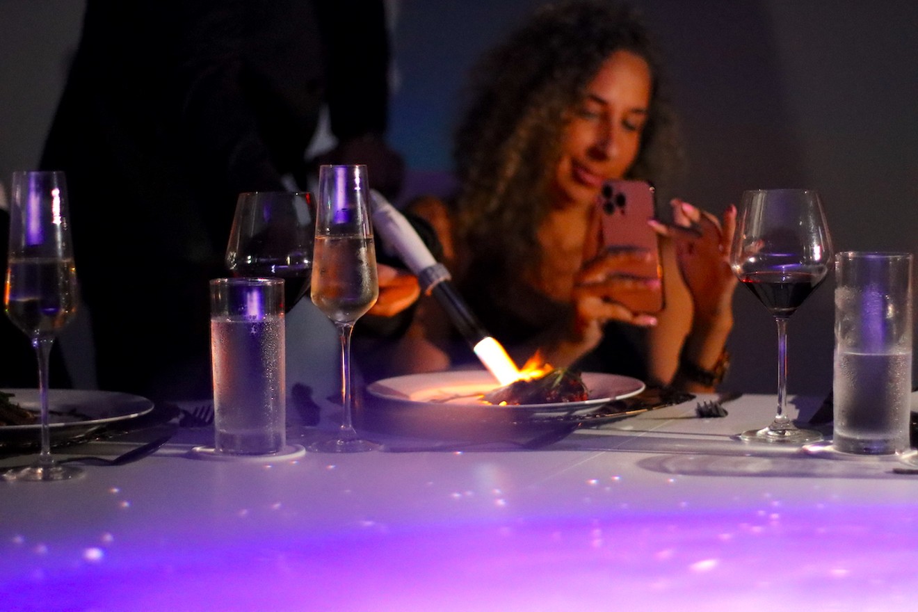A guest enjoying a recent Atmos Immersive Dining experience in Fort Lauderdale.