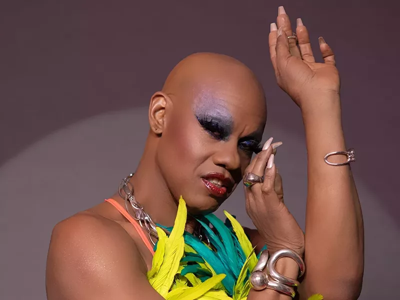Image: Portrait of Kevin Aviance with heavy makeup and long nails