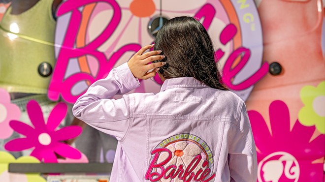 Model wearing Barbie-embroiders denim jacket