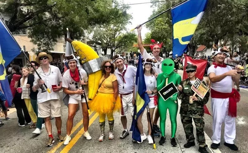 Image: Participants in the King Mango Strut Parade in Coconut Grove line the street in costume
