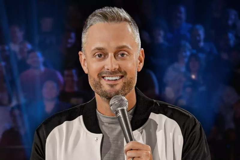 Image: Comedian Nate Bargatze holding a microphone