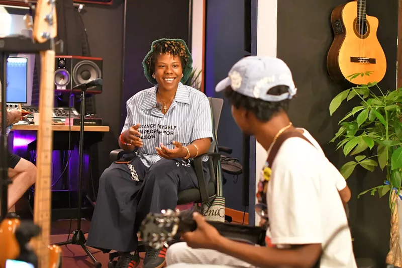 Image: two musicians working in a music studio