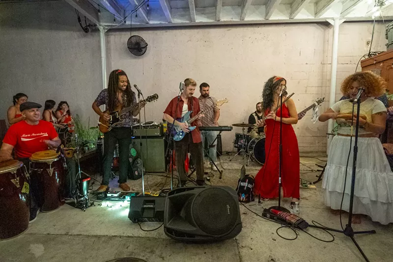 Image: Picture of a ten-piece cumbia band rehearsing