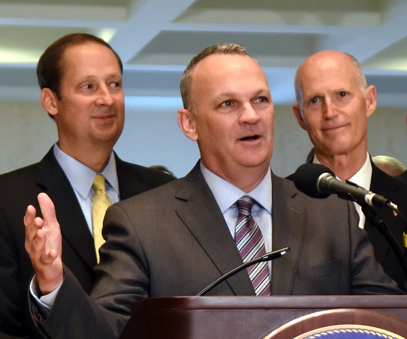 Richard Corcoran speaks at the end of a special legislative session, flanked by Rick Scott (right) and Joe Negron (left), on June 9, 2017.