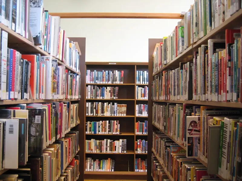 Image: a photo of bookshelves in a library