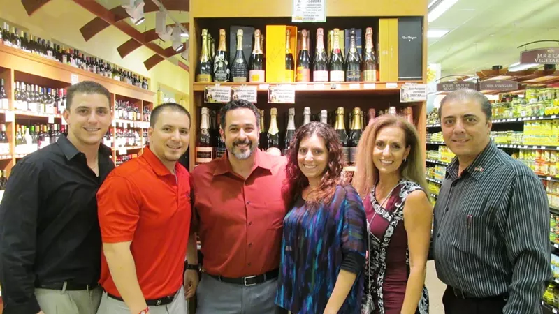 Image: The Alfanos — (from the left) Nick, John, Gary Mule, Jacqueline, Donna, and John — have built the Doris Italian Market empire into a specialty grocery mainstay in South Florida.