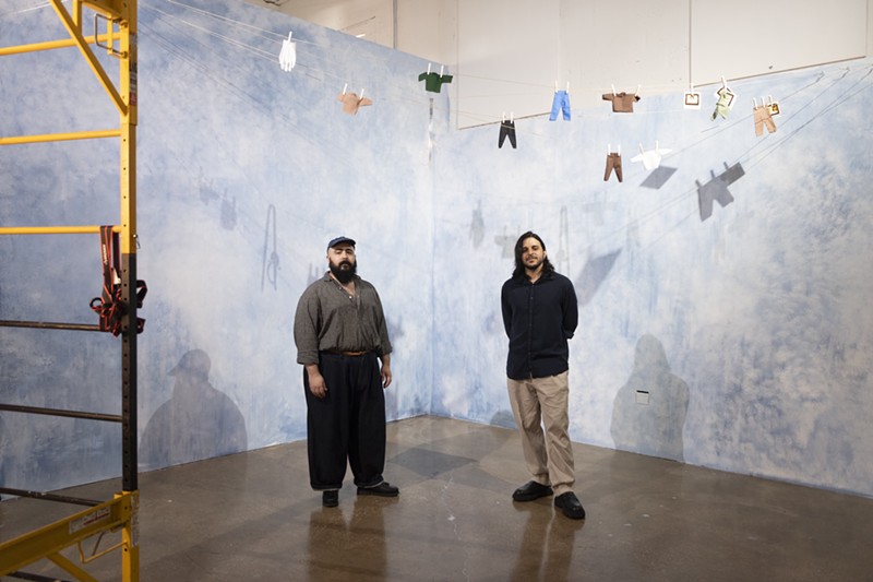 Adrian Rivera (left) and Daniel Almeida present their art installation "The Elephant Never Forgets" at Locust Projects.