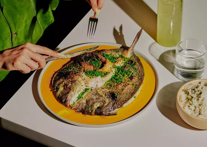 Image: a fish dish on a yellow plate