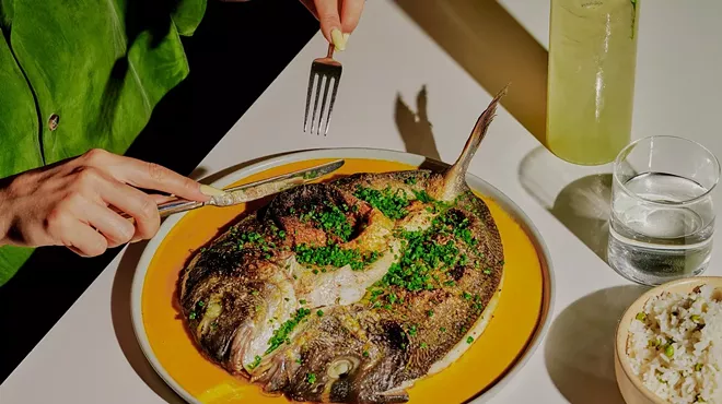 a fish dish on a yellow plate