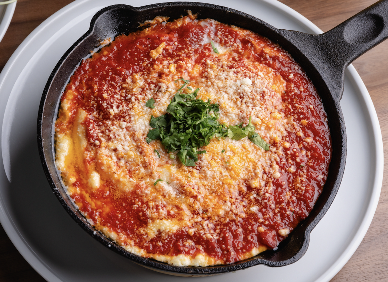 Bar Luca serves a robust breakfast menu, with options like the "Eggs in Purgatory," made with two poached eggs served on a bed of spicy red sauce and creamy polenta and served with toast.