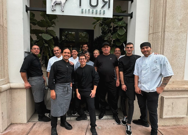 The team behind Tur Kitchen poses in front of the restaurant to announce its closure in Coral Gables after four years.