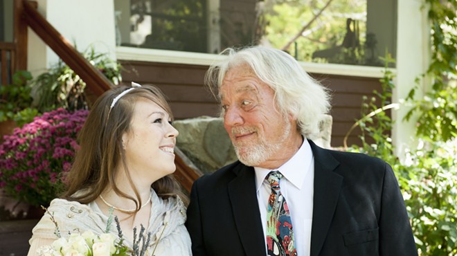 color stock photo of a young bride with an old bearded man
