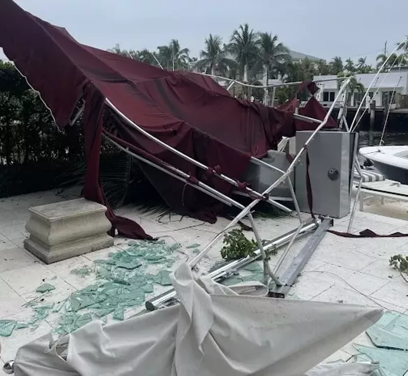 Image: Broken glass and a destroyed canopy left in the path of a January 6, 2024, tornado in Fort Lauderdale.