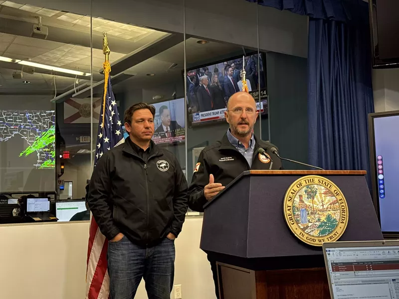 Image: two men at a podium