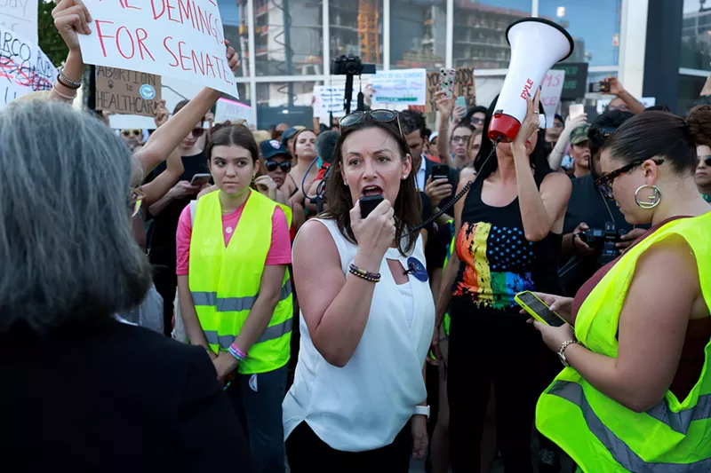 Image: A crowd gathers in the streets of Miami during a protest for abortion rights