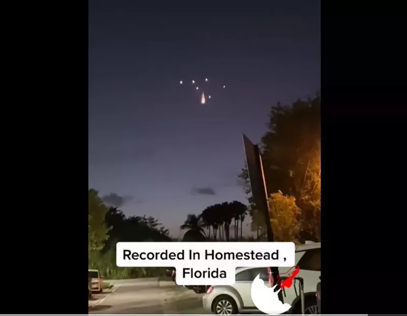 Image: A group of lights break apart and stay suspended in the air over Homestead