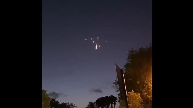 A group of lights break apart and stay suspended in the air over Homestead
