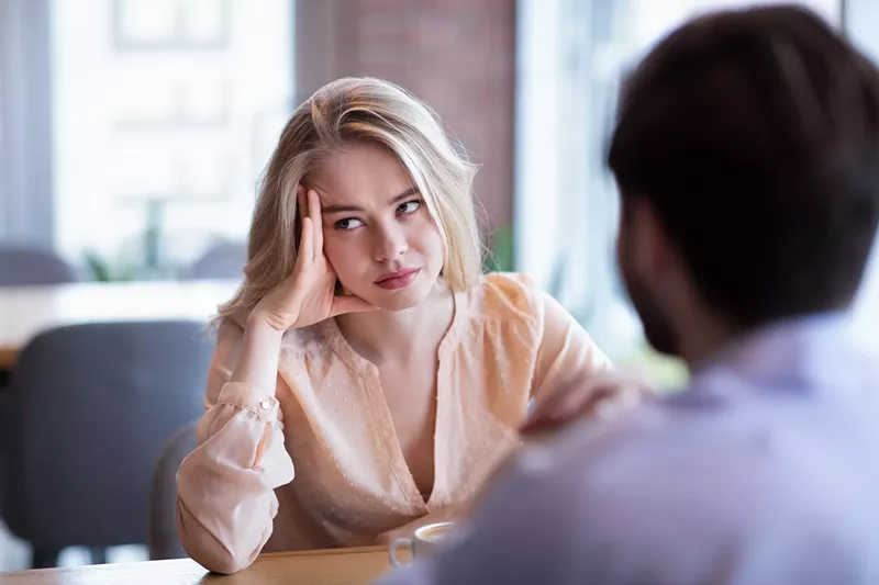 Image: Woman bored at a restaurant
