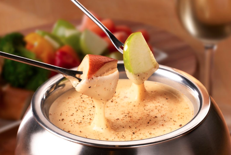 Apples dipped in creamy cheese fondue at the Melting Pot.
