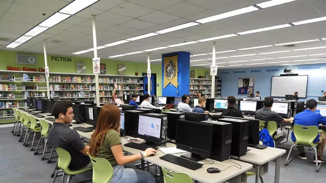 Pictured are high school students working on computers in a computer lab in a Hialeah high school.