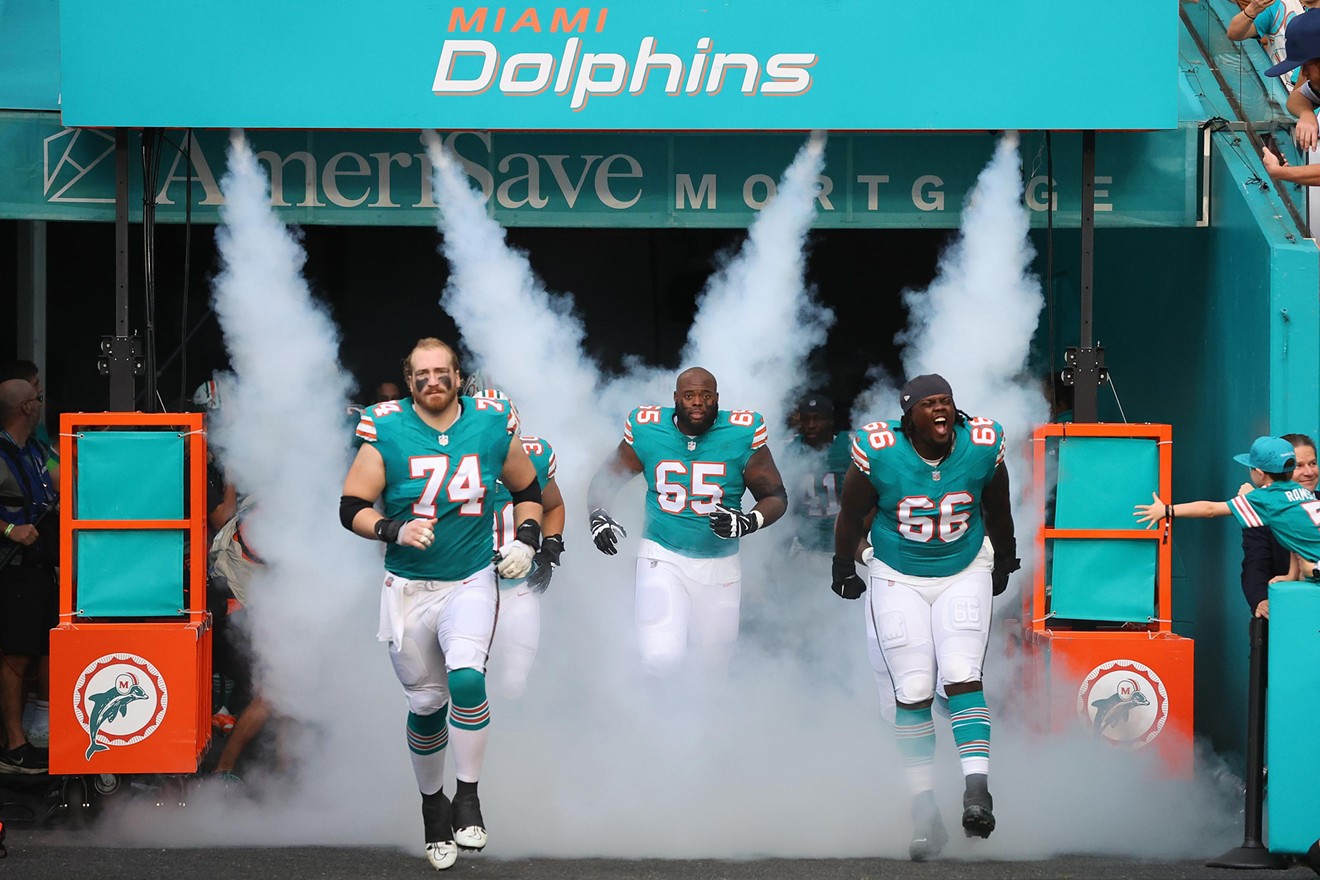 The Miami Dolphins take the field prior to a game against the Dallas Cowboys at Hard Rock Stadium on December 24, 2023 in Miami Gardens.