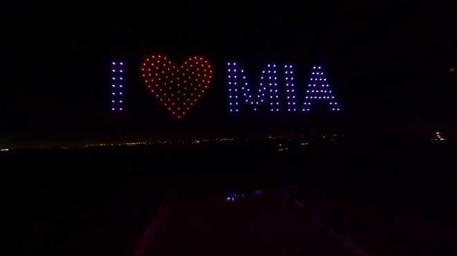 Drones spelling out I heart MIA in the night sky