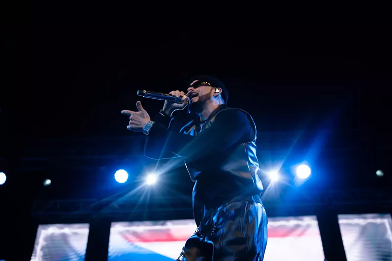 Image: Yandel performing onstage at at the Pérez Art Museum Miami