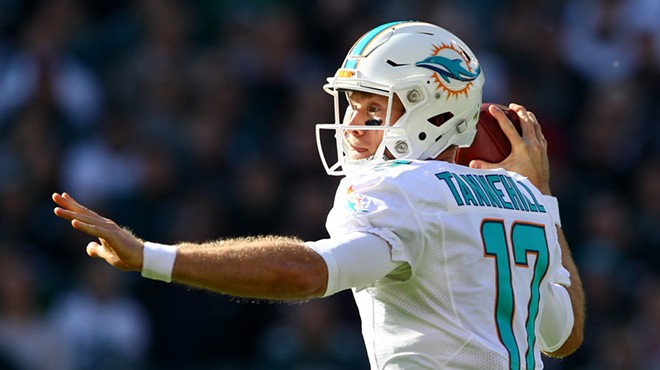 Quarterback Ryan Tannehill winds up for a pass with his front arm extend and his throwing arm ready for release