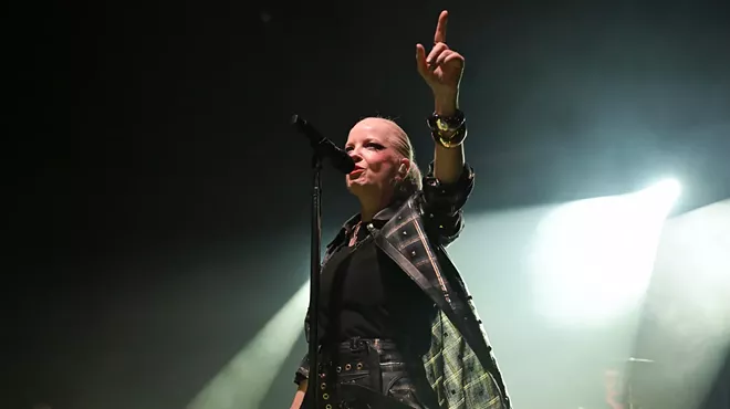 Picture of Garbage's singer Shirley Manson singing on stage.