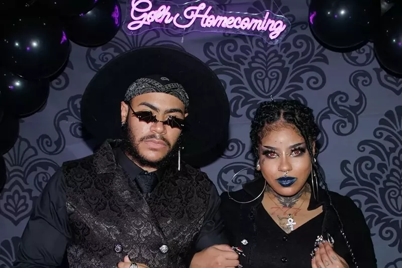 Image: A couple dresses in all black at Goth Homecoming