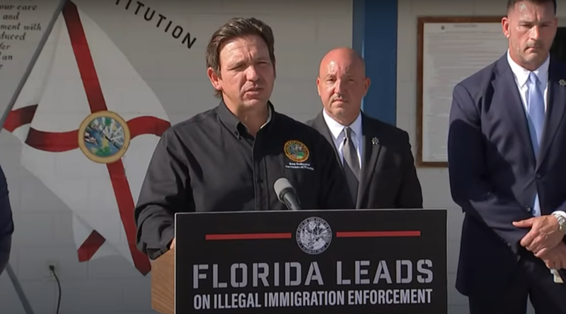 Image: Gov. Ron DeSantis speaking at a press conference.