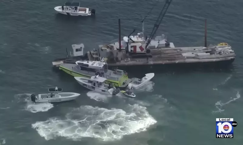 Image: aerial photo showing the aftermath of a July 28, 2025, collision between a barge and a small sailboat off Hibiscus Island north of the MacArthur Causeway, Miami Beach