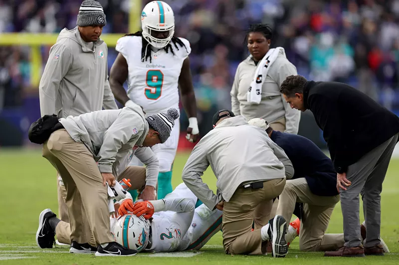 Image: Injured Miami Dolphins linebacker splayed out on the field