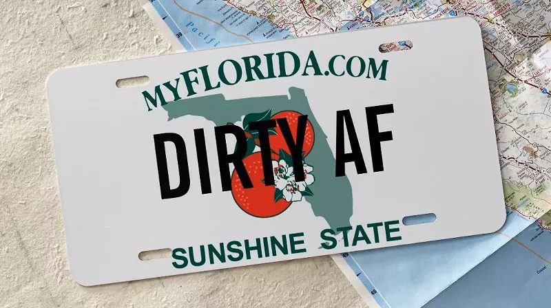 Image: Florida license plate that reads, "DIRTY AF" laying on top of a map.