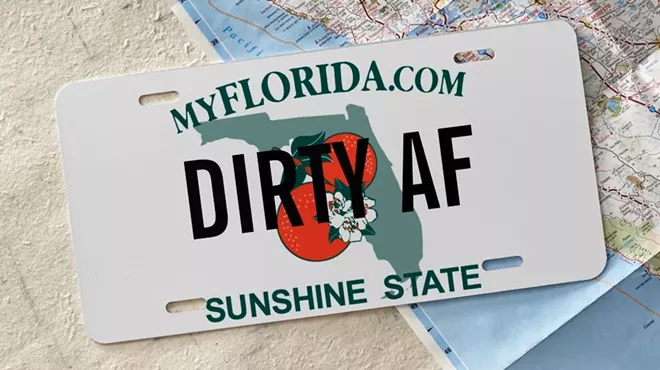 Florida license plate that reads, "DIRTY AF" laying on top of a map.