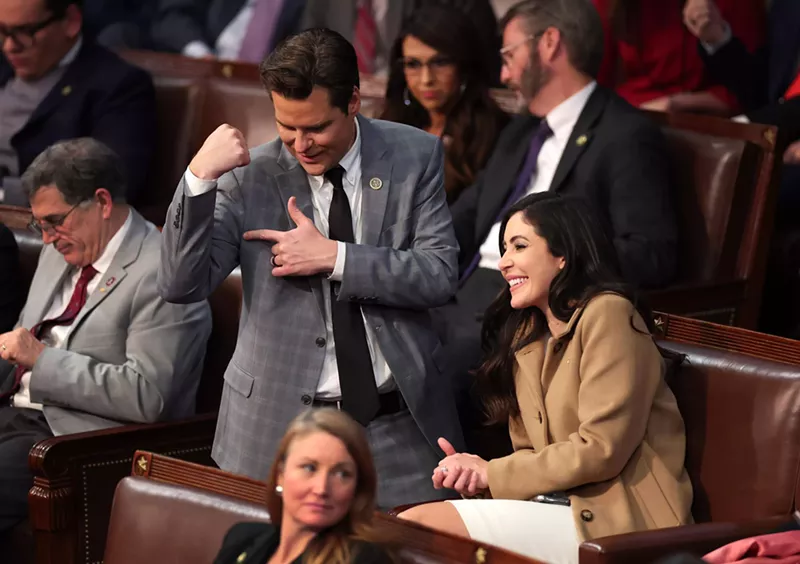 Image: Rep. Matt Gaetz flexes his arm alongside Rep. Anna Paulina Luna after getting into an argument with Rep. Mike Rogers in the House Chamber on January 6, 2023.