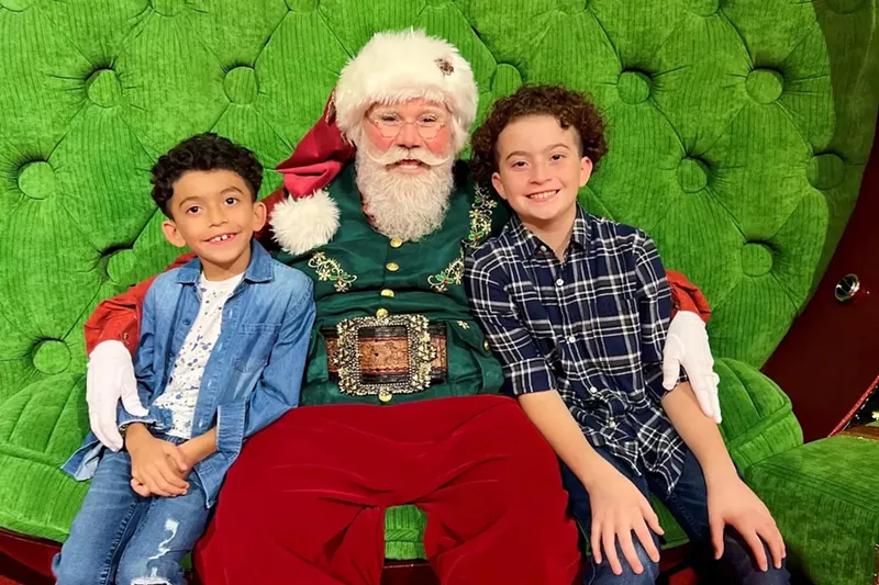 Image: Children posing with Santa Claus at Aventura Mall